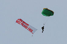 AFP Paratroopers perform a paradrop at DNSTC bringing banners reading "DavNor Best Palaro Ever," "Till We Meet Again," and "Maraming salamat po!" AFP Paratroopers perform a paradrop during Palarong Pambansa 2015 Closing Ceremony.jpg