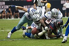 Dallas Cowboys defensive players force Houston Texans running back Arian Foster to fumble the ball Arian Foster fumble.jpg