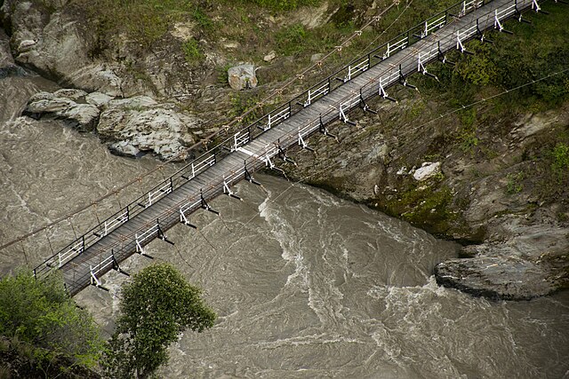 A white border painted on a suspended bridge delineates Azad Kashmir from Jammu and Kashmir