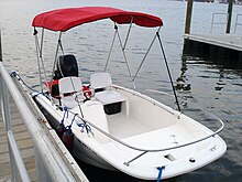 A boat with a Bimini top BostonWhaler130SS2009 1.jpg