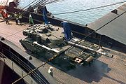 Challenger 1 tank of the UK's 1st The Queen's Dragoon Guards with IFOR markings on a loading ship