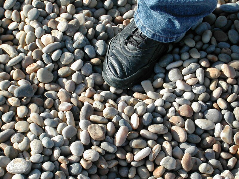 File:Chesil Stones with shoe for scale.JPG