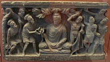 Conversion of the three Kashyapa brothers and their followers, Gandhara. The naked attendant is the Buddha's guardian, Vajrapani. Conversion of the ascetics (visit of the three Kashyapa borthers with their disciples).jpg