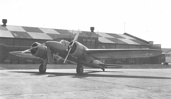Curtiss YA-14 in front of hangar.jpg