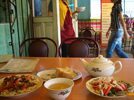 Laghman, salad, and green tea, a simple café meal