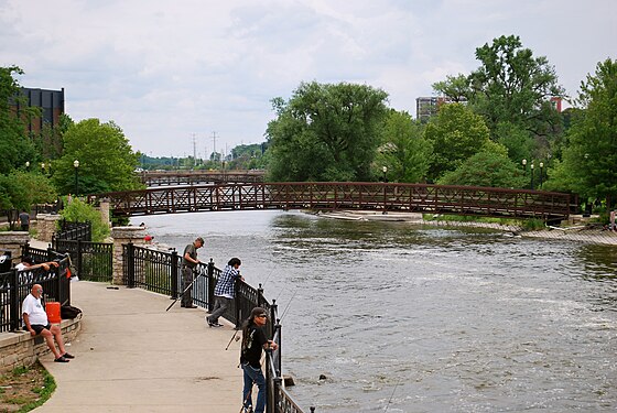 Fishing the Fox River on a riverwalk in Elgin, IL