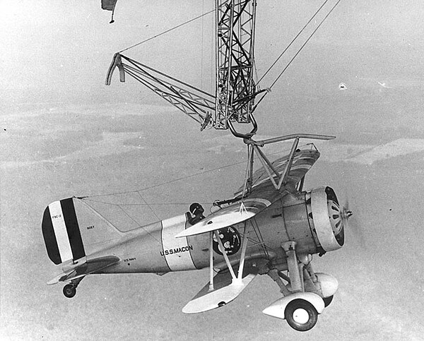 A Sparrowhawk fighter attached to the "trapeze" apparatus of Macon, 1933