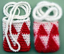 Amulet bags before (on left) and after felting in a washing machine. FeltedAmuletBags.jpg