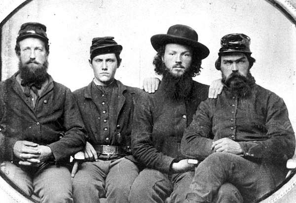 A tintype of Private Curtis P. Casey, Co. H; Private Dwight Chappell (Chappel), Co. F; Edgar Cove; and Sgt. George R. Ferris, Co. H, all members of th