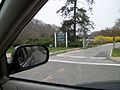 A driveway to Frank Melville Memorial Park between the Post Office and the Setauket Mill Pond.