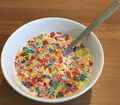 Fruity Pebbles cereal with milk.png