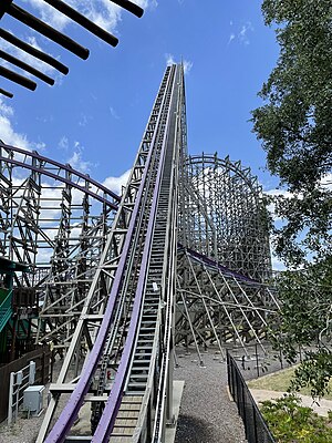 The lift hill of Iron Gwazi with various parts of the layout imaged