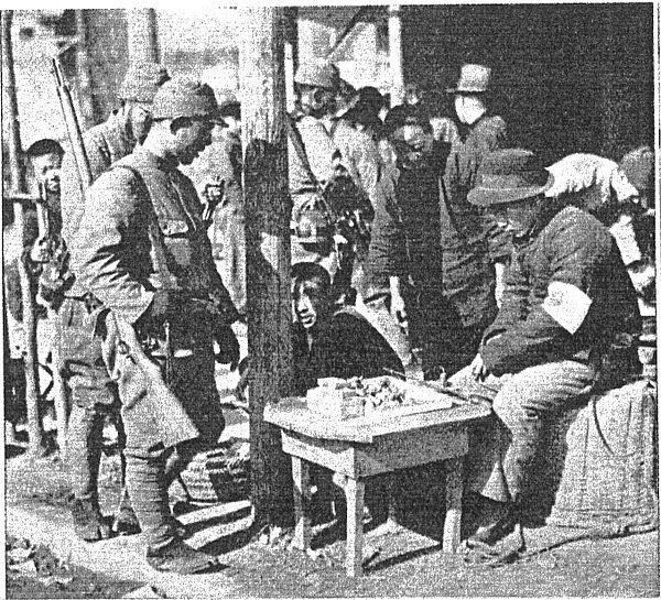 Chinese civilians assisting Japanese soldiers