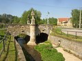 Stone arch bridge over the Bakovský potok stream in village of Královice. The bridge is decorated with pair of statues depicting St. Wenceslas and St. John Nepomucene, patrons of Bohemia.