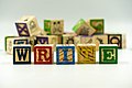Learning to write with children's letter blocks - 51070633961.jpg