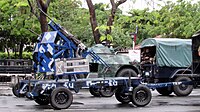 A M39 cannon platform being towed by a Kia KM450 light truck