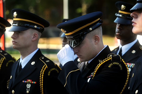 A member of the Maryland Army National Guard Honor Guard team adjusts his cover prior to competing in the military funeral honours event during the 20