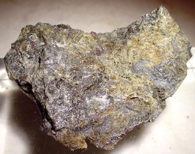 Native mercury with cinnabar, Socrates mine, Sonoma County, California. Cinnabar sometimes alters to native mercury in the oxidized zone of mercury de