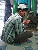 Sitting man praying