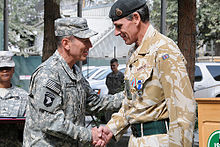 General David Petraeus presents Parker with the NATO Meritorious Service Medal. Nick Parker David Petaeus.jpg