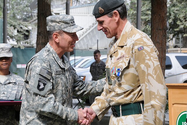 General David Petraeus presents Parker with the NATO Meritorious Service Medal.
