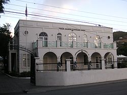 The Legislative Council building in Road Town, erected about sixty yards from the market where Faulker roused the crowds. Old LegCo Building, Road Town.jpg