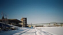 2006 picture of the canoeing-rowing basin with the finish tower on the left. West of the basin on the island is the Circuit Gilles Villeneuve. Olympic bassin on Ile Notre Dame.jpg