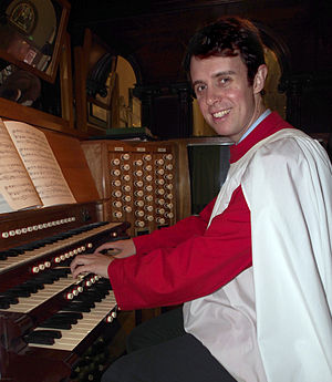 Pipe organists must learn both finger substitution and foot substitution. Organist Alistair Nelson.JPG