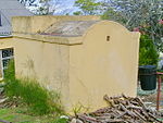 Swellendam was still a fairly remote outpost of civilisation at the beginning of the 19th century. The inhabitants of the district strongly opposed the administration at the Cape, and this resulted in much dissatisfaction and even open revolt. A vital co Type of site: Powder Magazine Previous use: Powder magazine. This simple rectangular powder magazine dates from the middle of the nineteenth century and was possibly erected by the well-known firm, Barry and Nephews. The property was owned by Cornelius Human, well known character that owned Human's Garage in town in the mid 20th century up to 1948. Before and during WWII he used it for aircraft fuel storage as he was the appointed supplier of fuel at the air strip which is in the Bontebok Park today. Both his children were born in the house, and I am one of them! - Piet Human. On the day we buried our mother in Swellendam, I visited this property and was surprised to see that the outbuilding is now a national monument - with an upside down mounted commission plaque!