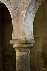 Simple capital of a Doric form supporting a Mozarabic arch, São Pedro de Lourosa Church, Portugal