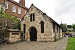 Parish Room of St Crux and wall attached to north-west corner