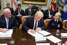 Trump signs an Executive Order promoting Agriculture and Rural Prosperity in America on April 25, 2017. Photo of the Day 4 26 17 (33770181373).jpg