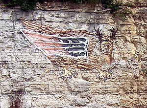 A modern painting of the "Piasa Bird", on the bluffs of the Mississippi River in Alton, Illinois. Wings were not present in the original painting. Piasa Bird May06.jpg