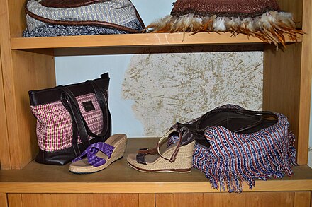 Artisan-made purses and shoes with ikat dyed fabric for sale in Malinalco, EdoMex, Mexico. The rapacejos (fringes) seen on the bottom right purse are characteristic of rebozos and can be quite intricately woven.