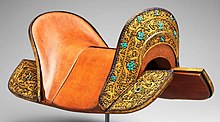 Set of plates for a saddle, c. 1400, in iron, gold, lapis lazuli, turquoise (and modern leather) Set of Saddle Plates MET DP330541 (cropped).jpg
