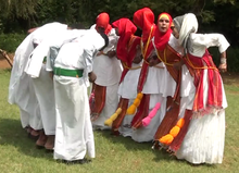 Somali young women and men performing the traditional dhaanto dance-song in Jubaland Somtradanhd4.png