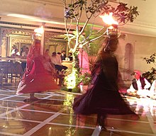 Spinning dancers balance flaming bowls on their heads, Udaipur, India. Spinning fire dancers of Udaipur.jpg