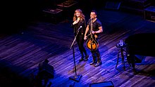 Springsteen's wife Patti Scialfa, a member of the E Street Band, during a 2017 performance of Springsteen on Broadway Springsteen On Broadway - Walter Kerr Theater - Thursday 2nd November 2017 SpringsteenBroadWay021117-43 (26448754919).jpg
