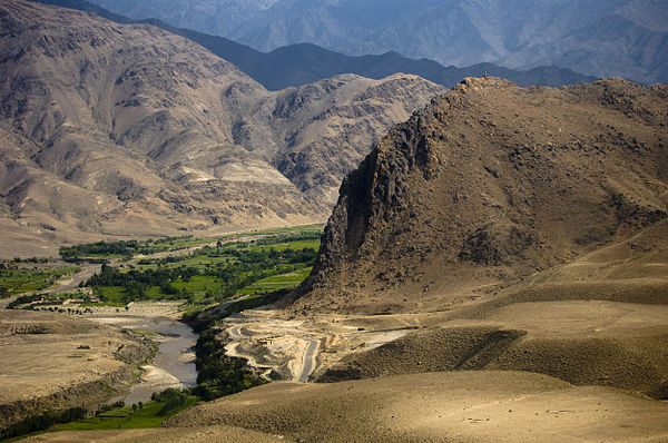 Lush greenery stands in stark contrast to the surrounding desert in Laghman Province