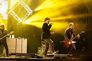 Titãs live at the Montevideo Rock 2018. From left to right: Branco Mello, Sérgio Britto and Tony Bellotto. Session members Mario Fabre and Beto Lee are not seen in the picture.