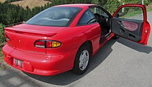 1998 Toyota Cavalier coupe (Japanese export model with taillights containing amber rear turn signals, right hand drive and flecked red-grey interior) Toyota cavalier coup japan export.jpg