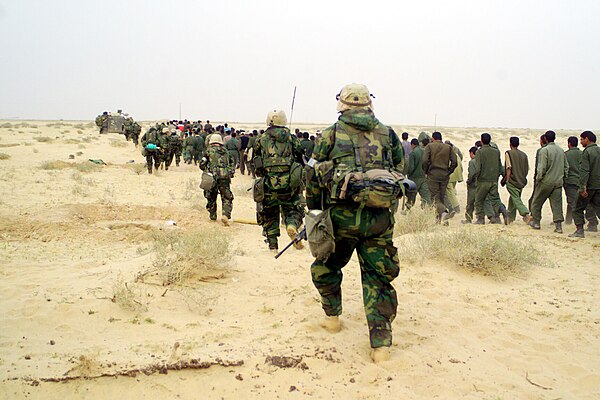 Image: U.S. Marines with Iraqi PO Ws   March 21, 2003