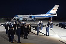 The casket of President Gerald Ford being lowered from the cabin of SAM 29000 at Andrews Air Force Base, Maryland, 2006. US Navy 061230-F-0194C-006 The casket of Gerald R. Ford, 38th president of the United States, arrives at Andrews Air Force Base, Md., Dec. 30, 2006.jpg