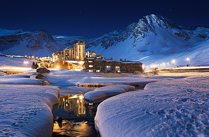 View from the lake towards the village in the foreground with the Grande Motte in the back. Val Claret at night.jpg