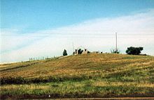 Wounded Knee hill, location of Hotchkiss guns during battle and subsequent mass grave of Native American dead Wounded Knee 96.jpg