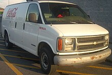 A Chevrolet Express van bearing the logo of the Coca-Cola Company '96-'02 Chevrolet Express Wagon Coca-Cola.jpg