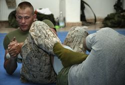 The regular heel hook twists the ankle medially. The opponent's leg is entangled to prevent him from escaping the hold. 040901-M-2789C-004heel hook.jpg