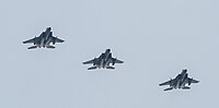 A formation of three F-15C/D Eagles overhead Kadena Air Base in Okinawa, Japan. The aircraft are assigned to the 18th Wing.