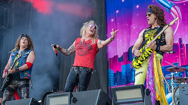 Steel Panther at Rock im Park in 2023. Left to right: Spyder, Michael Starr and Satchel