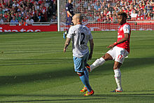 Song playing for Arsenal Alan Hutton and Alex Song (6867564898).jpg